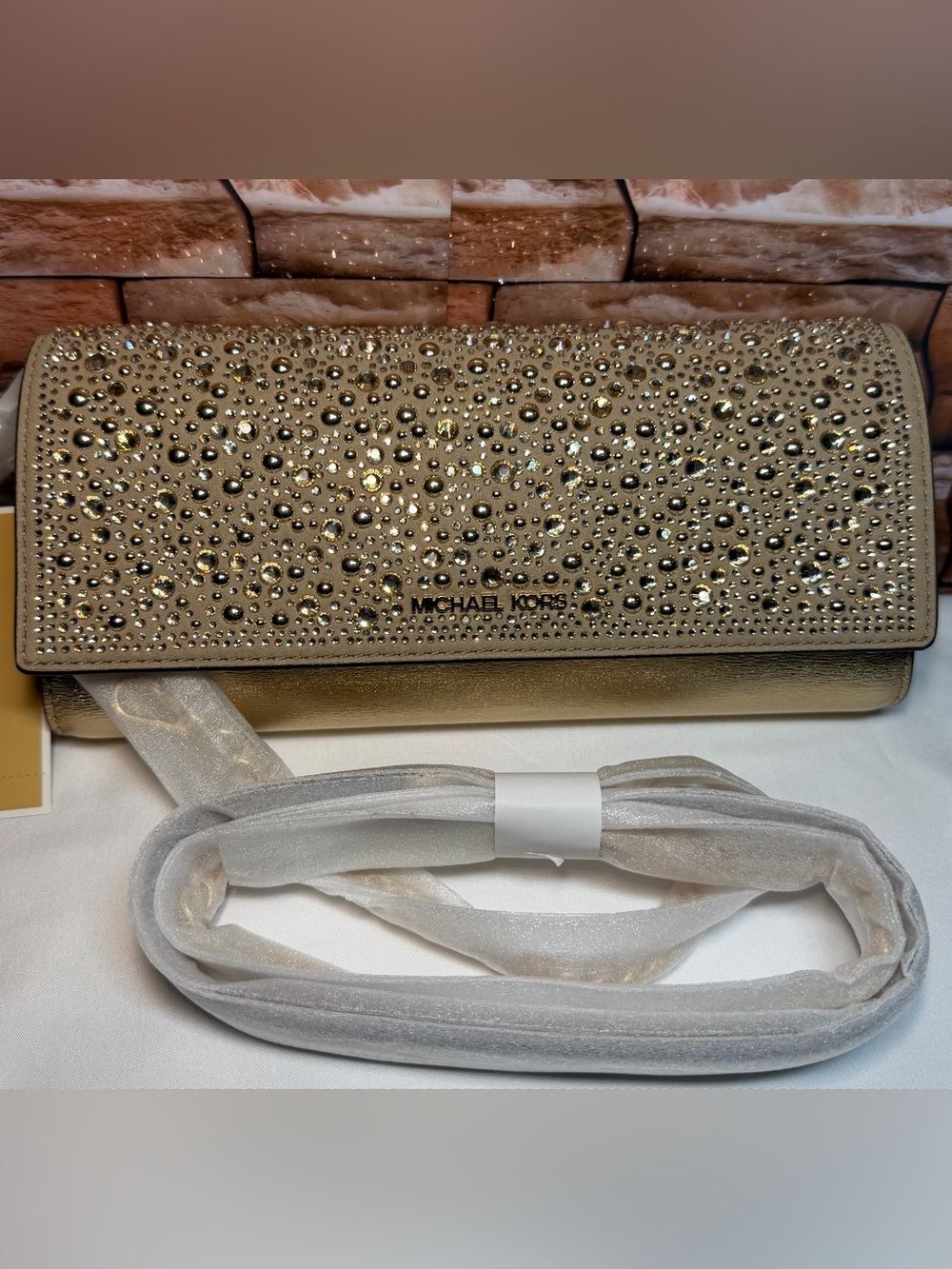 MICHAEL KORS JET SET MEDIUM METALLIC LEATHER CLUTCH
